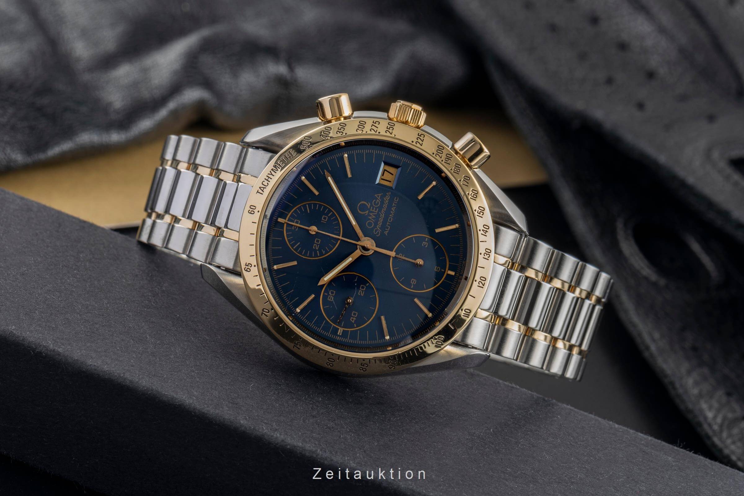 Omega Speedmaster Date chronograph steel / gold automatic
