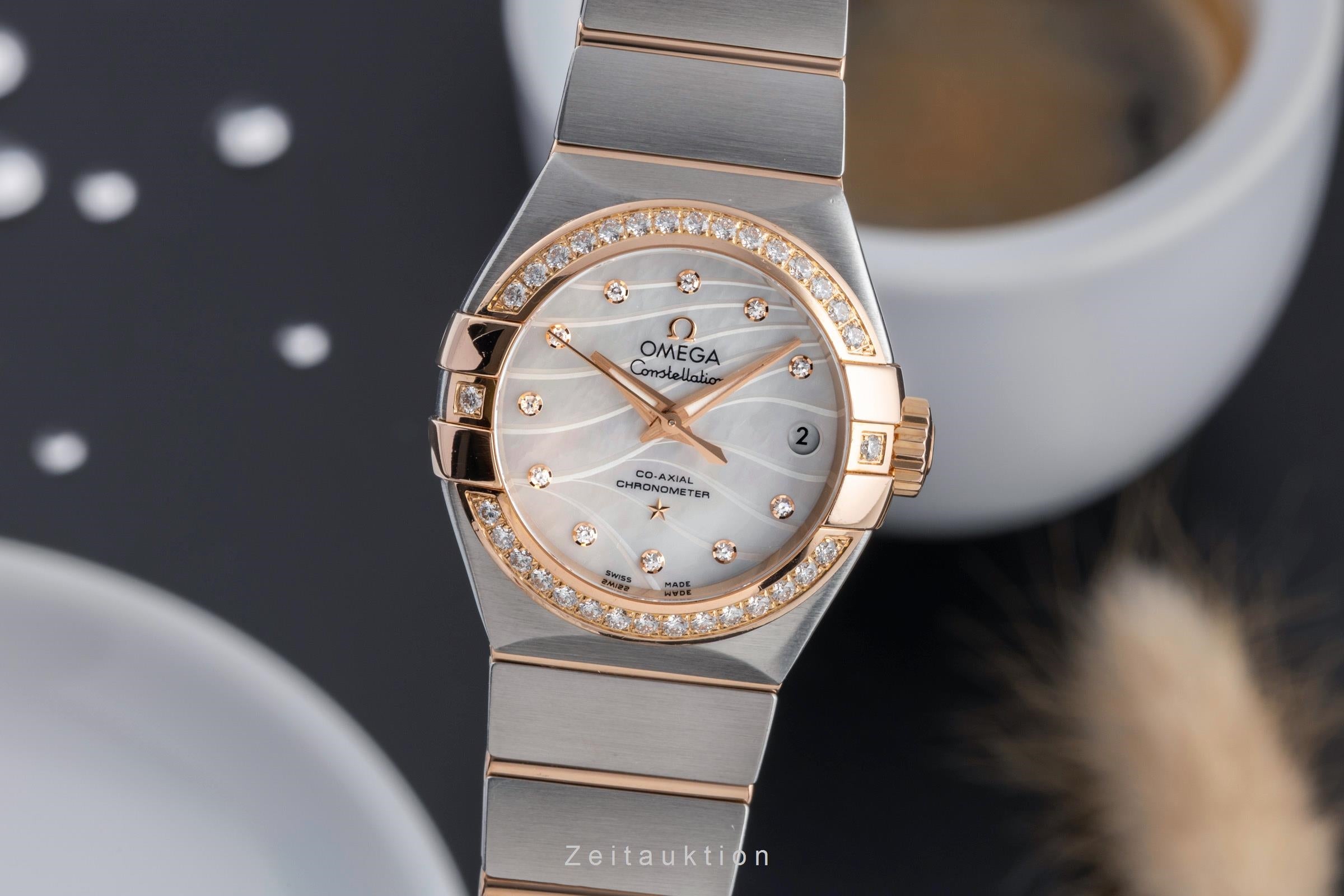 Omega Constellation steel / gold automatic women's watch 123.25.27.20.55.004  [2502219]