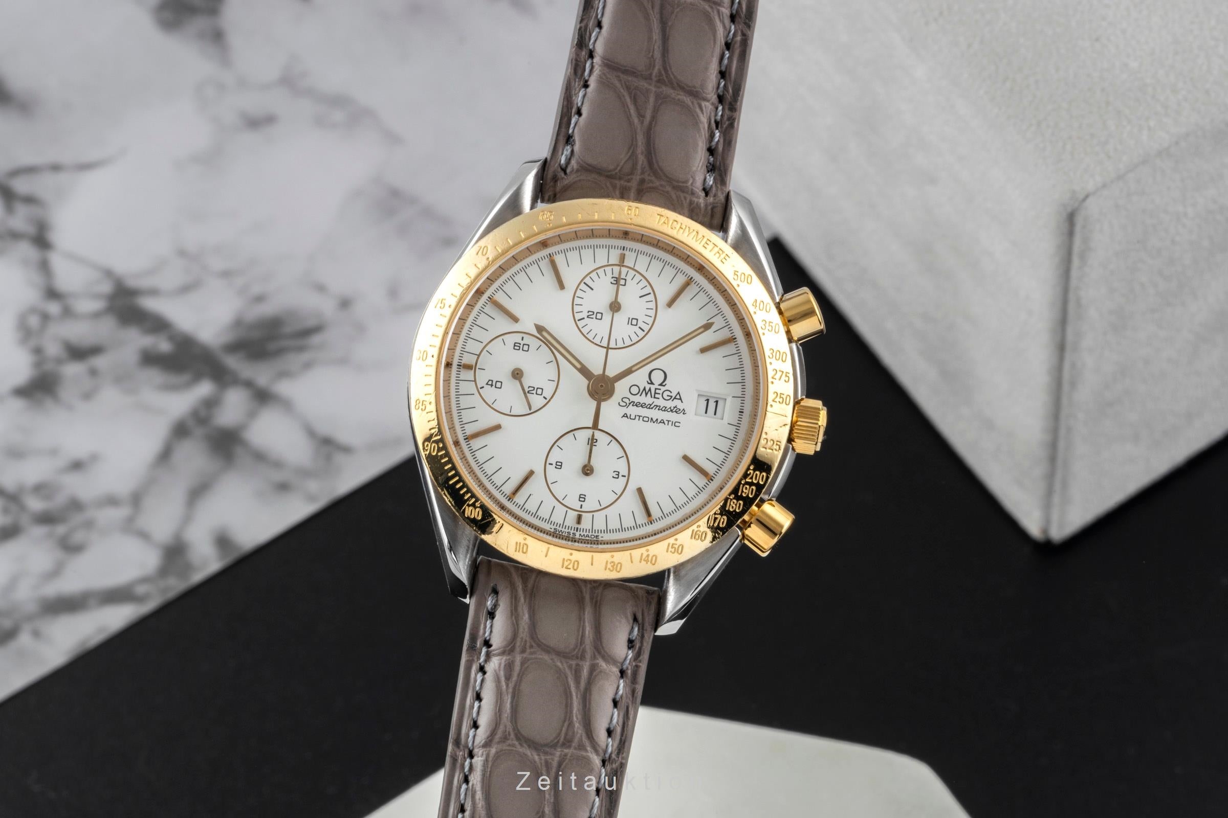 Omega Speedmaster Date chronograph steel / gold automatic men's watch 3311.20 LP: 8200EUR  [2600526]