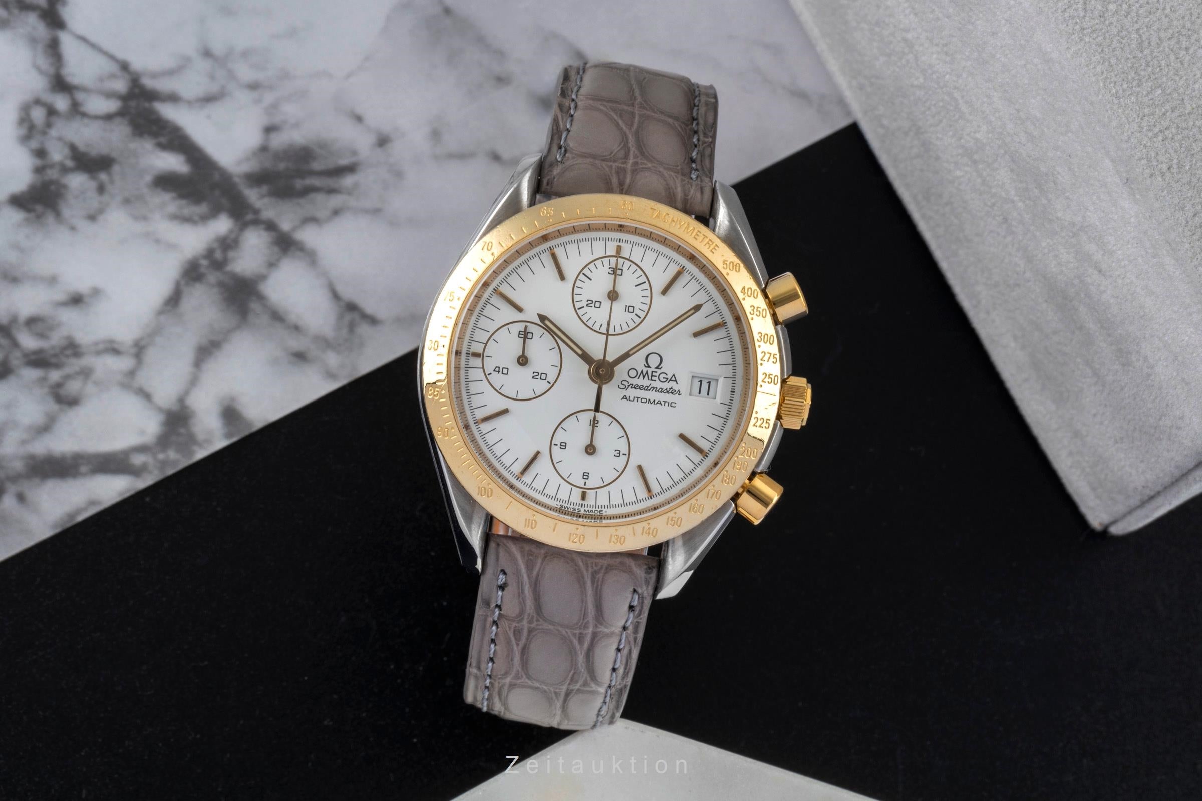 Omega Speedmaster Date chronograph steel / gold automatic men's watch 3311.20 LP: 8200EUR  [2600526]